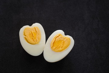 boiled eggs on black background