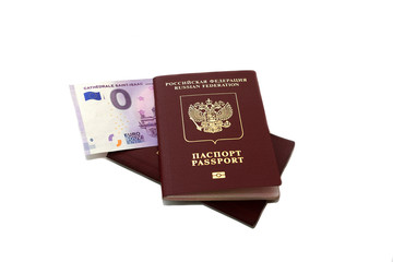 Two Russian foreign passports with a bundle of money. Immigration or tourism concept. Banknote zero...