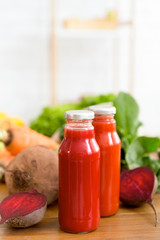 Healthy detox smoothie in glass bottles with beet juice