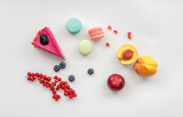Sweets, fruits and berries on white background for coffee