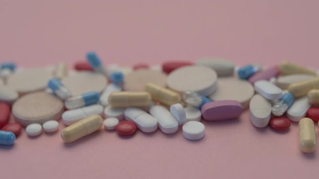 Various medicine pills and tablets, close up dolly shot