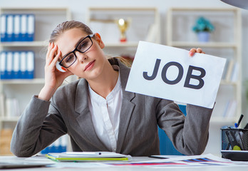 Businesswoman sitting in office with message
