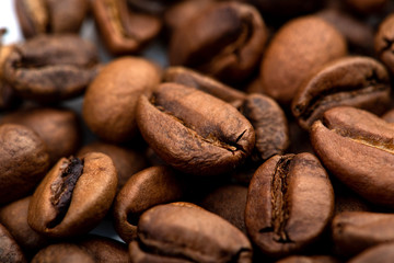 Coffee beans close-up background. Fresh roasted