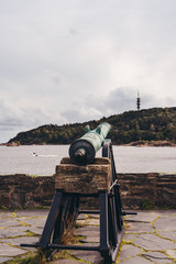 Gun pointing out to the sea at the Christiansholm Fortress in Kristiansand Norway