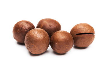 Shelled  macadamia nuts on white background
