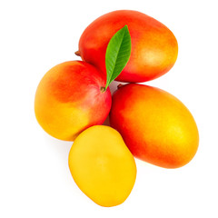 Mango isolated on the white background. Pile of fresh tropical mangoes top view