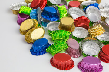 background of colorful foil candy cups