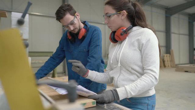 Students in carpentry doing a job training in workshop