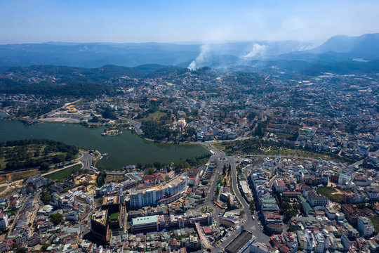 Aerial photo of Da Lat or Dalat, Vietnam city center and surrounds including alpine lake, Cathedral and mini Eiffel tower