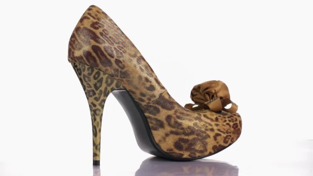 Fashion beautiful womens shoes high-heeled shoes.Rotation on a white background.