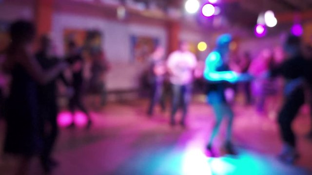Social dancing in a latin dance club, blur