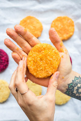 Vegan chickpea burgers cutlets or patties. Healthy vegan diet food. Adult and child hands hold vegan burger's cutlets.