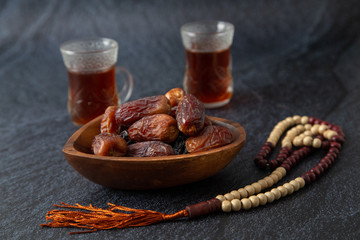  food Ramadan Sweets dried fruits and nuts Tea with a rosary and the on the table white,  Concept: month fasting culture Muslim and prayer for god, Ramadan food symbolic eastern Arabian