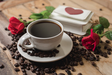 Coffee and roses on the wood floor