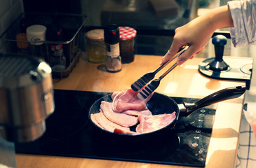 Female cooking breakfast on kitchen counter bar.Healthy food,simple eating