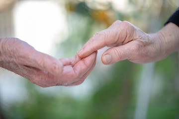 Senior couple hands holding