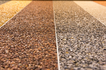 Close up of a natural stone carpet. Decorative stone coating. Slip resistant floor finish...