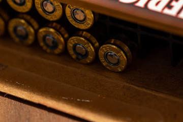 Macro photo of an open box of rifle ammunition