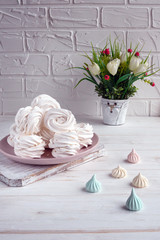 Handmade apple white homemade marshmallows on a pink plate. White background.