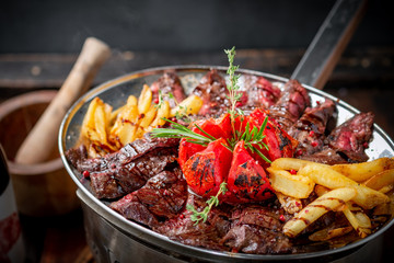 Mixed roast beef steaks set on a plate of tenderloin and Striploin. Barbecue menu for the restaurant