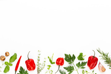 Spice herbal leaves and chili pepper on white background. Vegetables pattern. Floral and vegetables on white background. Top view, flat lay.