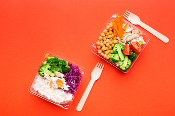 Lunch boxes with healthy food on a bright paper background. Healthy eating concept for the office