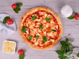 pizza with tomatoes and cheese