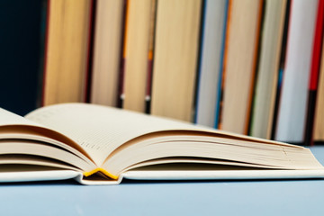 Stack of old books in a library , retro tone and grain noise, vintage collection