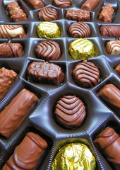Chocolate candies of different shapes in the box