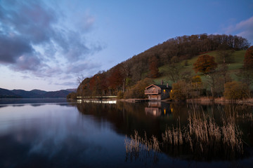 Fototapeta premium Epic vibrant sunrise Autumn Fall landscape image of Ullswater in Lake District with golden sunlight