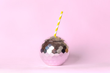 Creative disco cocktail shaped ball cup and paper straw with flash effect sparkle and shine on pink...