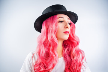 Girl with pink hair on a white background