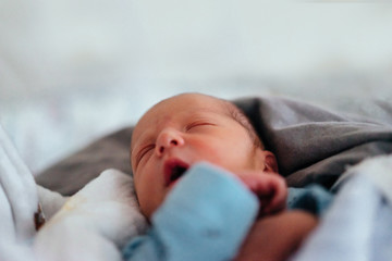 Authentic photography of a newborn with slightly lower birth weight. 