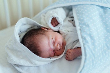 Authentic photography of a newborn with slightly lower birth weight. 