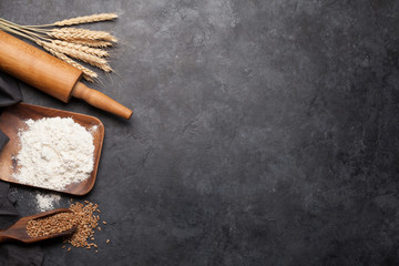 Various bread ingredients. Wheat, flour and cooking utensils