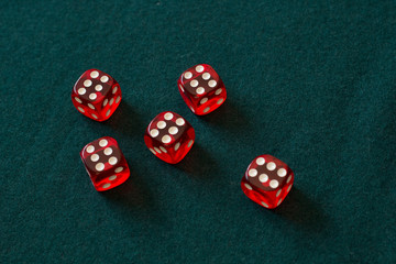 red dices on green cloth casino gambling luck