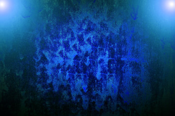 Abstract background dripping blue paint from rusty metal.