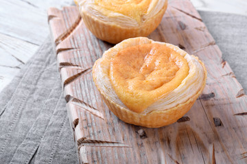 Puff pastry cakes with vanilla cream. Traditional Portuguese dessert Pasteis de Belem