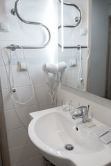 bathroom washbasin, wall mounted hair dryer