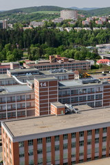 Traditional Zlin red brick buildings exterior, former shoe factory, Moravia, Czech Republic, sunny summer day, aerial view