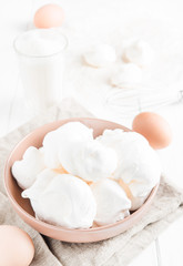 Fototapeta na wymiar Baked meringue with ingredients on white background