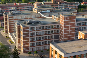 Traditional Zlin red brick buildings exterior, former shoe factory, Moravia, Czech Republic, sunny...