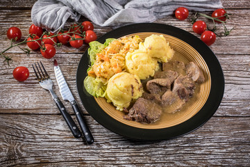 Braised pork tongues in horseradish sauce.