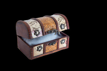 Wooden casket on a black background.