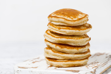 stack of delicious pancakes on a white background, closeup