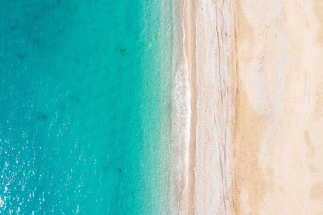 Aerial view of turquoise sea waves and sandy beach, Turkey, Antalya.