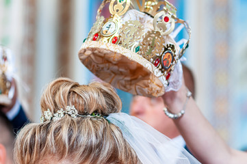 Golden crown on the head of the bride