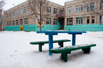 benches in the playground in winter