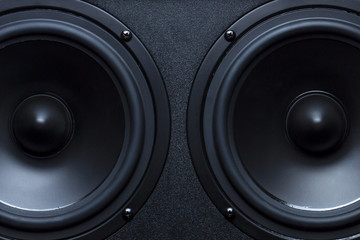 Two black speakers close-up as a background. - obrazy, fototapety, plakaty