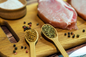 Still life with raw food and spices on the wooden backgrpound